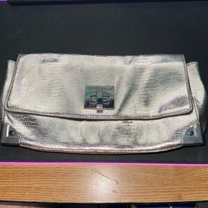 Almosy new just little use but 
missing strap for cross body use (chain)